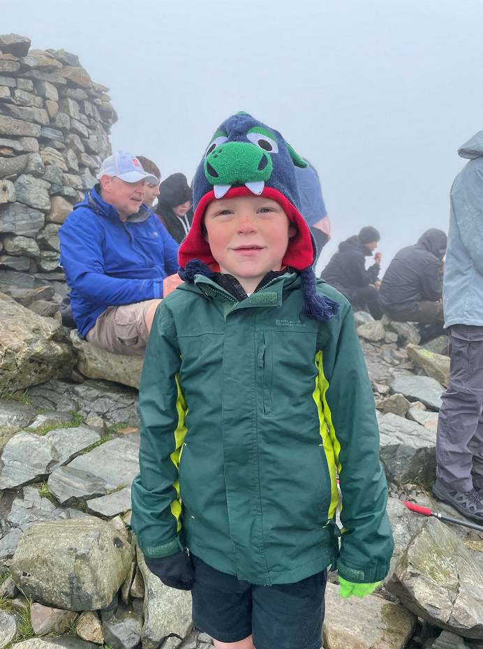 Joseph Hodgson at the summit of Scafell Pike.