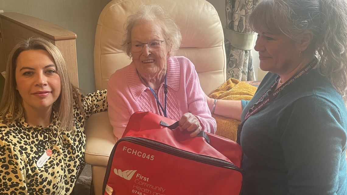 Care home resident with Red Bag